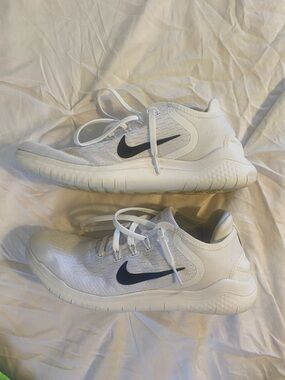 Nike White Athletic Sneakers with Black Swoosh. Womens 9.5 mens 8